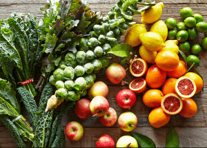 a group of fruits and vegetables on a wood surface Healthy Weight Loss Diets Braintree
