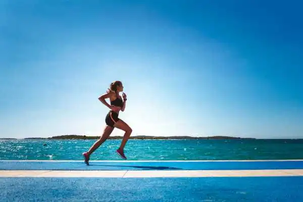 Woman running showing strong leg muscle Braintree
